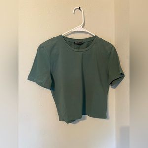 It is a crop women’s top. The brand is Zara.
